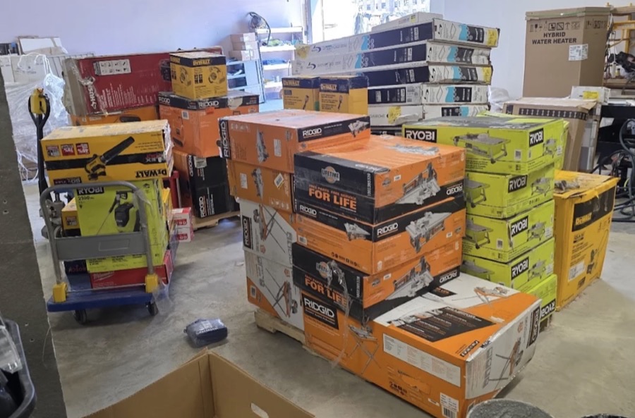 Boxed outdoor and patio merchandise including gazebos and umbrellas at ABC Home Outlet